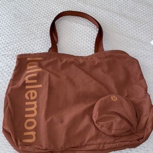 Lulu Tote Bag. Small tear on handle shown in picture.